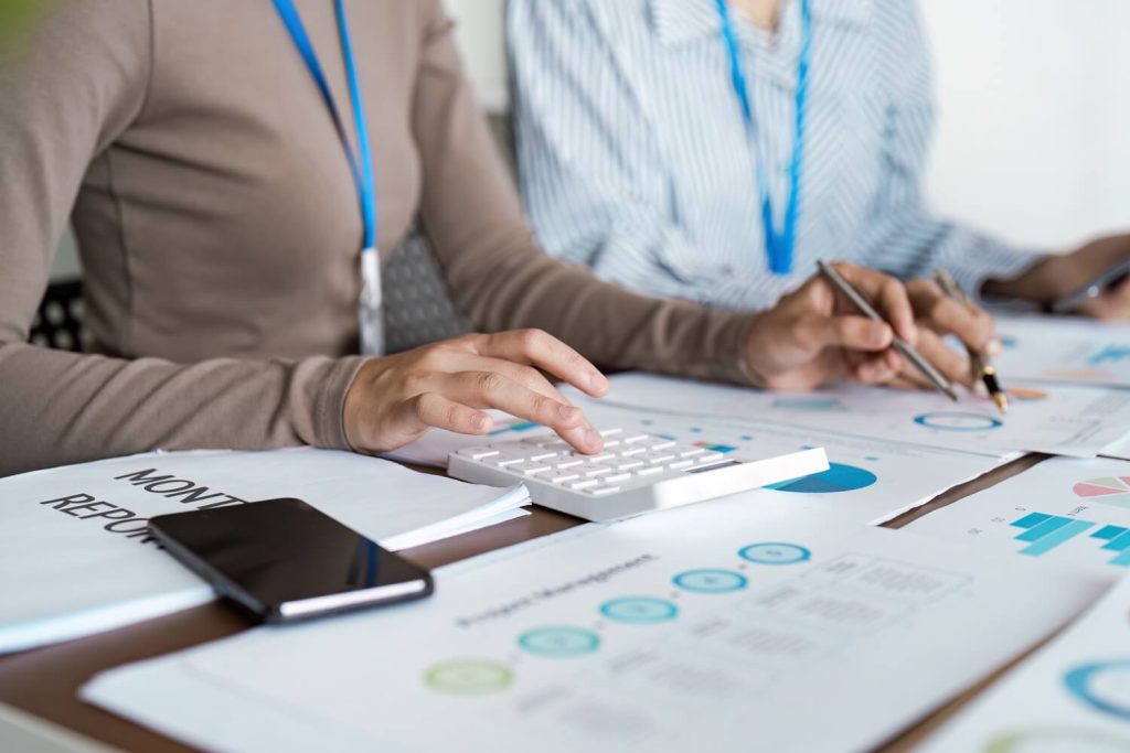 Clean office desk with documents prepared for approval steps.