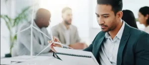 The human side of compliance showing a professional reviewing regulatory documents digitally for corporate governance and risk management