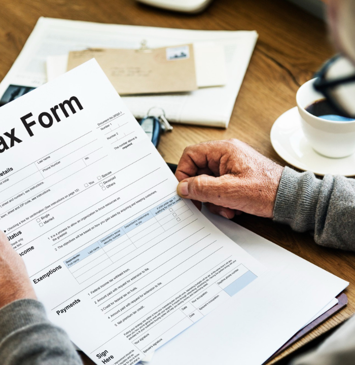 Document-focused activity taking place at a work desk.