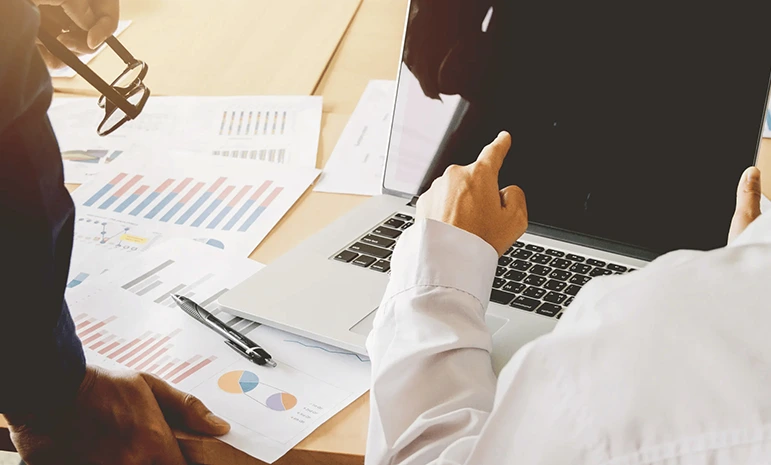 Navigating internal auditing in the UAE in 2026 with professionals analyzing financial reports and audit data