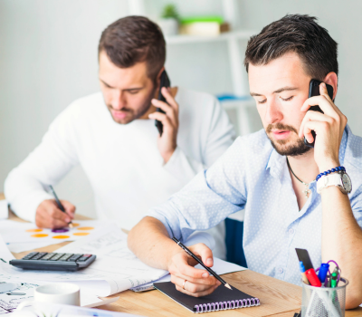 Business consultants discussing financial reports and calculations