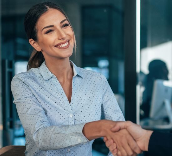 Desk-level view of business forms being reviewed and confirmed.