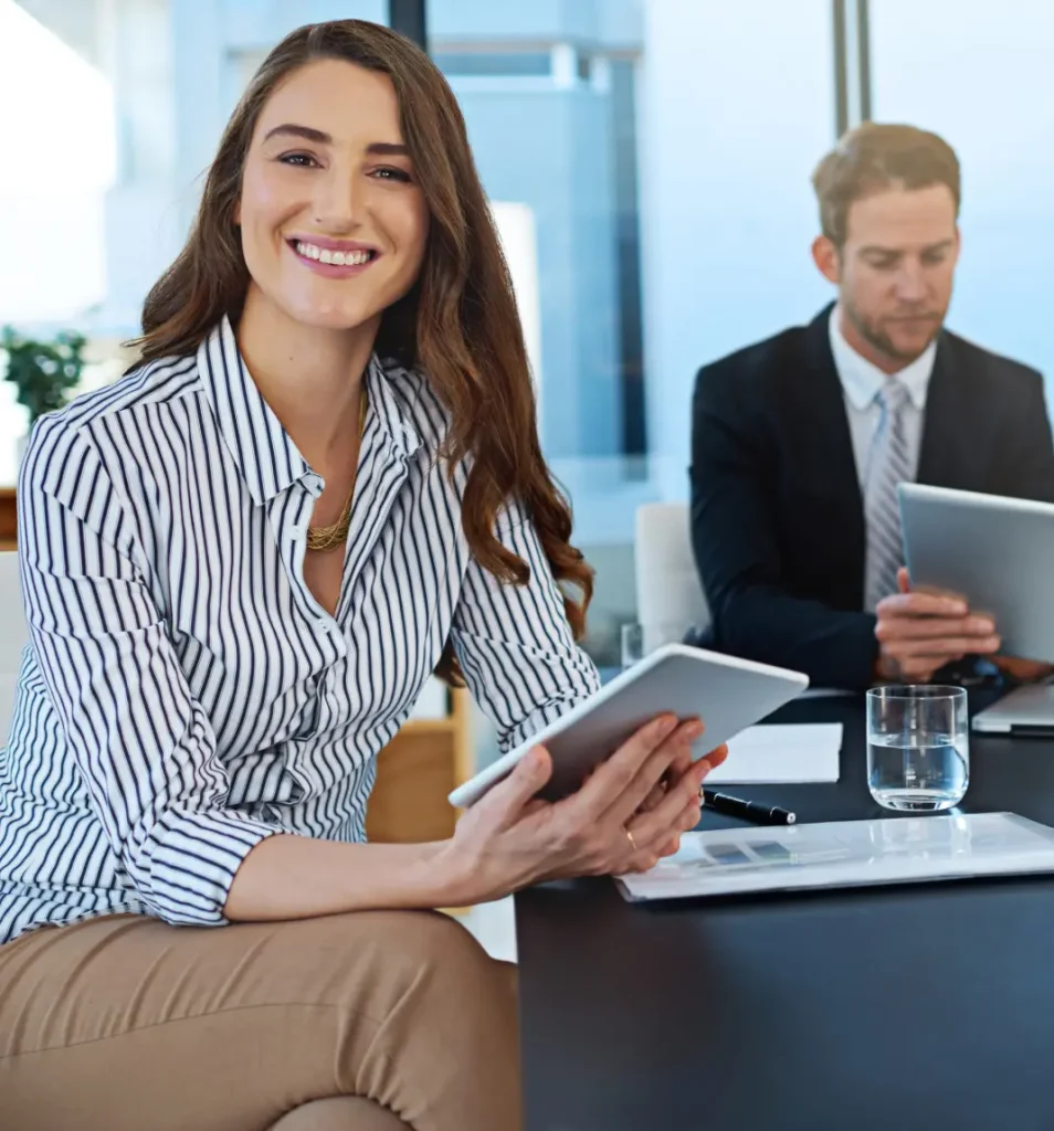 Business consultant reviewing financial data on tablet during office meeting