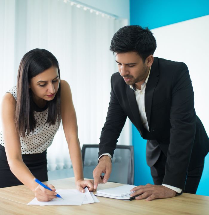 Team of professionals brainstorming and reviewing data together